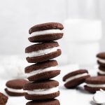 Five gluten-free oreos stacked on top of each other.