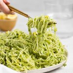 Kale pesto in spaghetti being twirled with a fork.