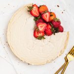 overhead image of healthy cheesecake with fresh strawberries