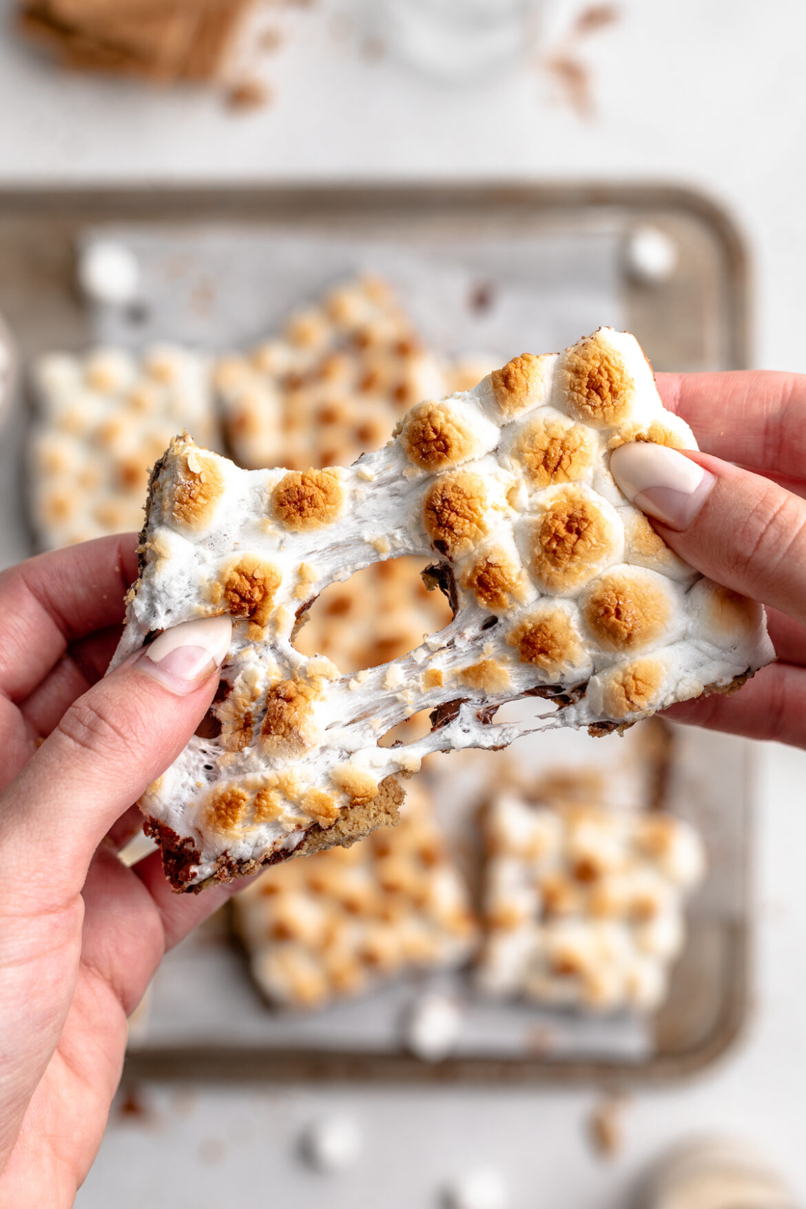 Gluten-Free S’mores Bars a s'mores bar being pulled apart.
