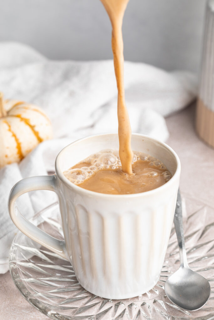 vegan pumpkin spice latte being poured into a mug