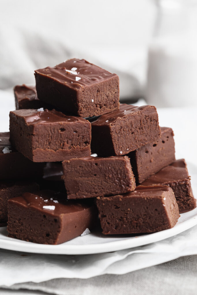 fudge without condensed milk stacked on a plate.