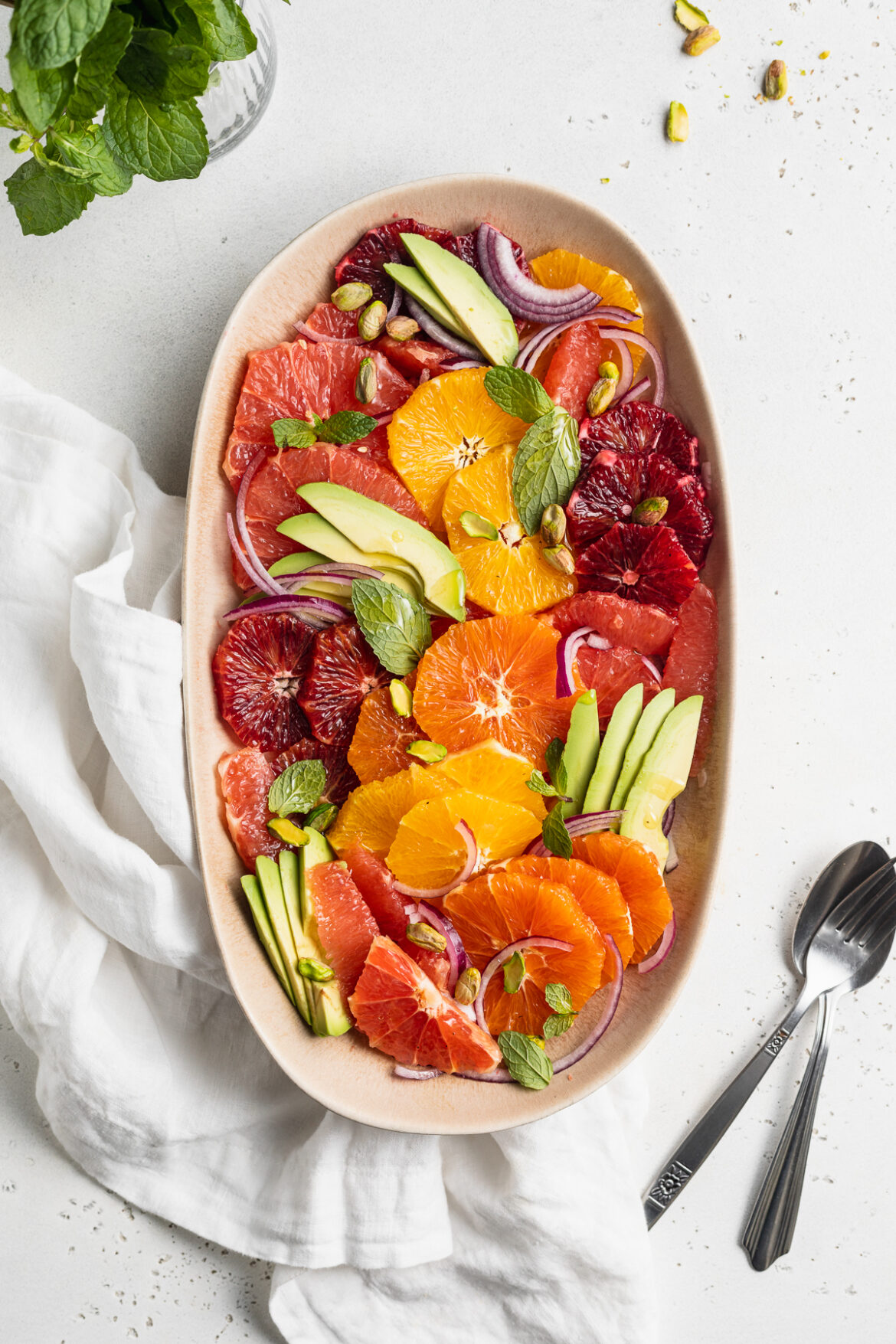 Citrus Salad with Avocado and Pistachios overhead image of citrus salad on a serving platter