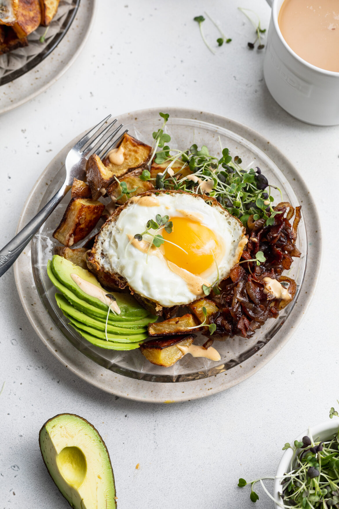 Ultimate Breakfast Bowl (a Maman Copycat!) breakfast bowl with coffee and avocado on the side.