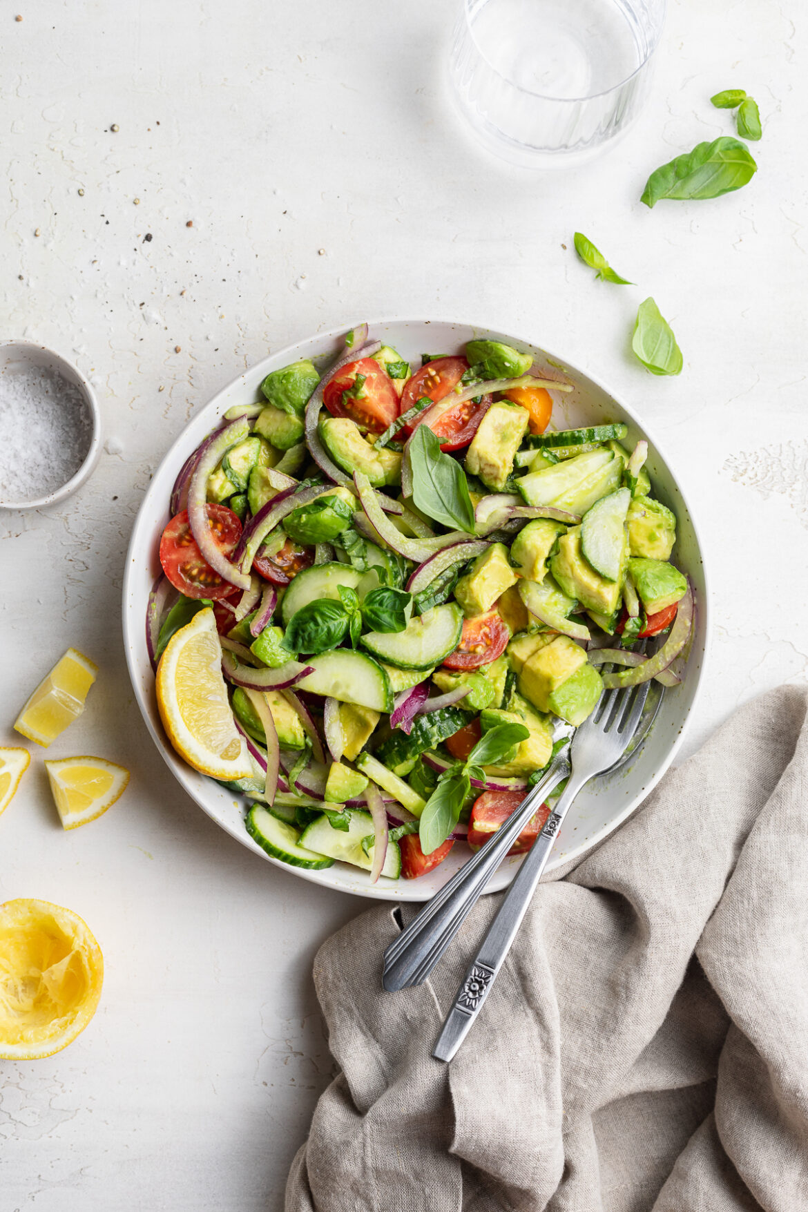 Fresh Avocado Salad (ready in 5 minutes!) overhead image of avocado salad in a bowl with lemon on the side