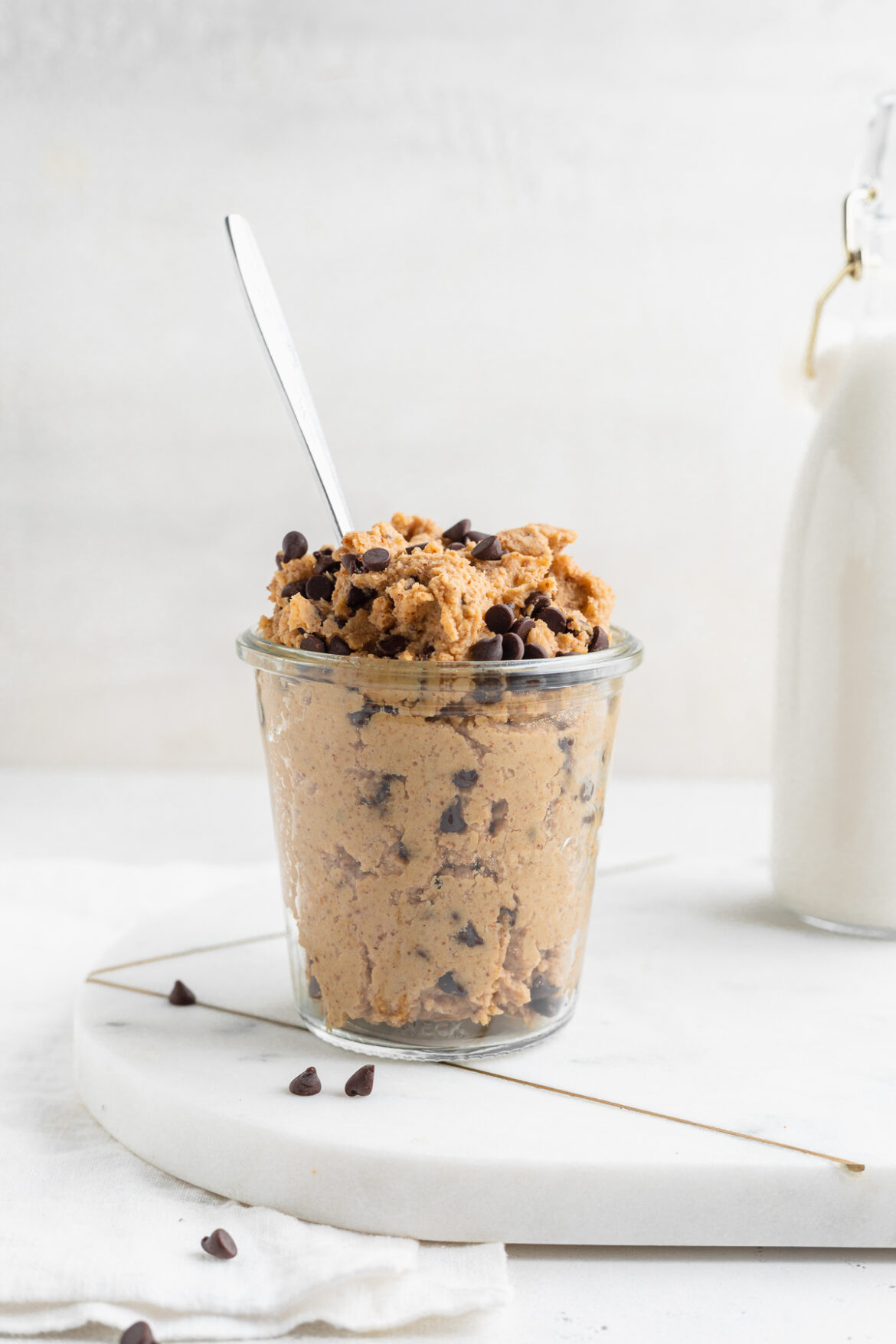 Chickpea Chocolate Chip Cookie Dough chickpea cookie dough in a jar with a spoon