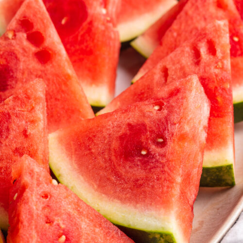 close-up image of watermelon cut into slices.