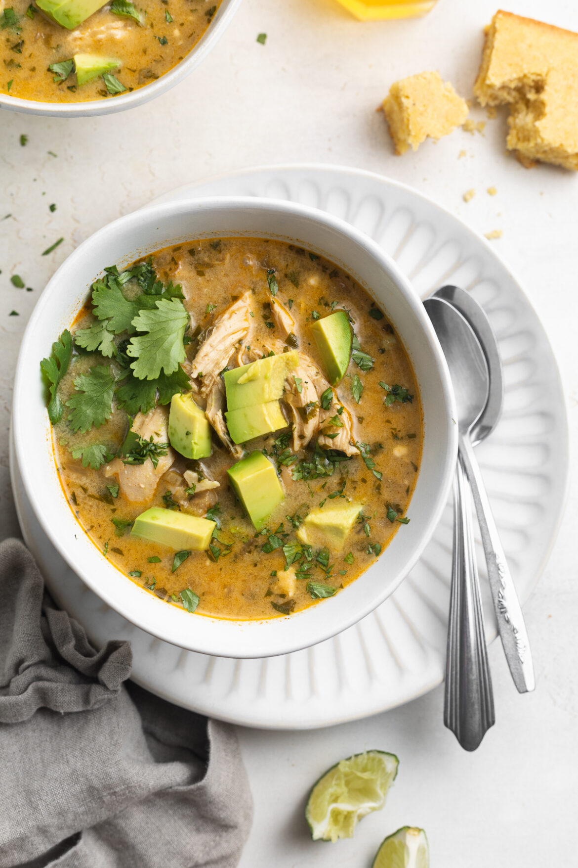 Instant Pot White Chicken Chili overhead image of Instant Pot white chicken chili with cilantro and avocado on top