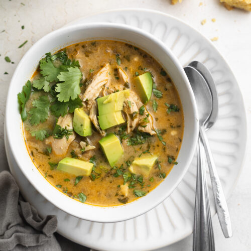 overhead image of Instant Pot white chicken chili with cilantro and avocado on top