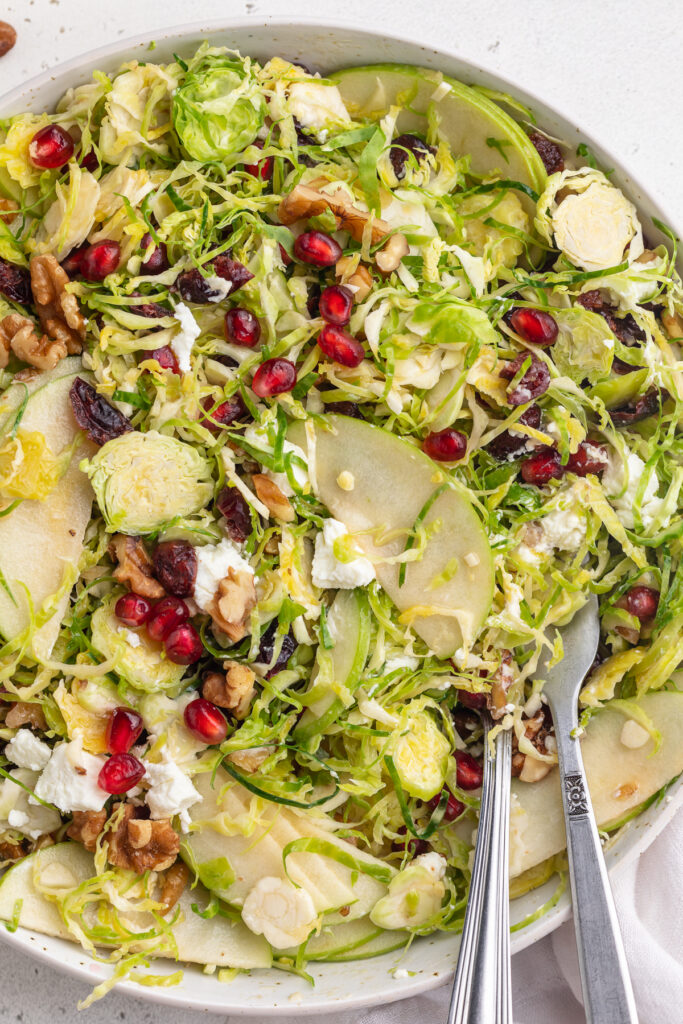 close-up image of brussels sprout salad in a bowl.