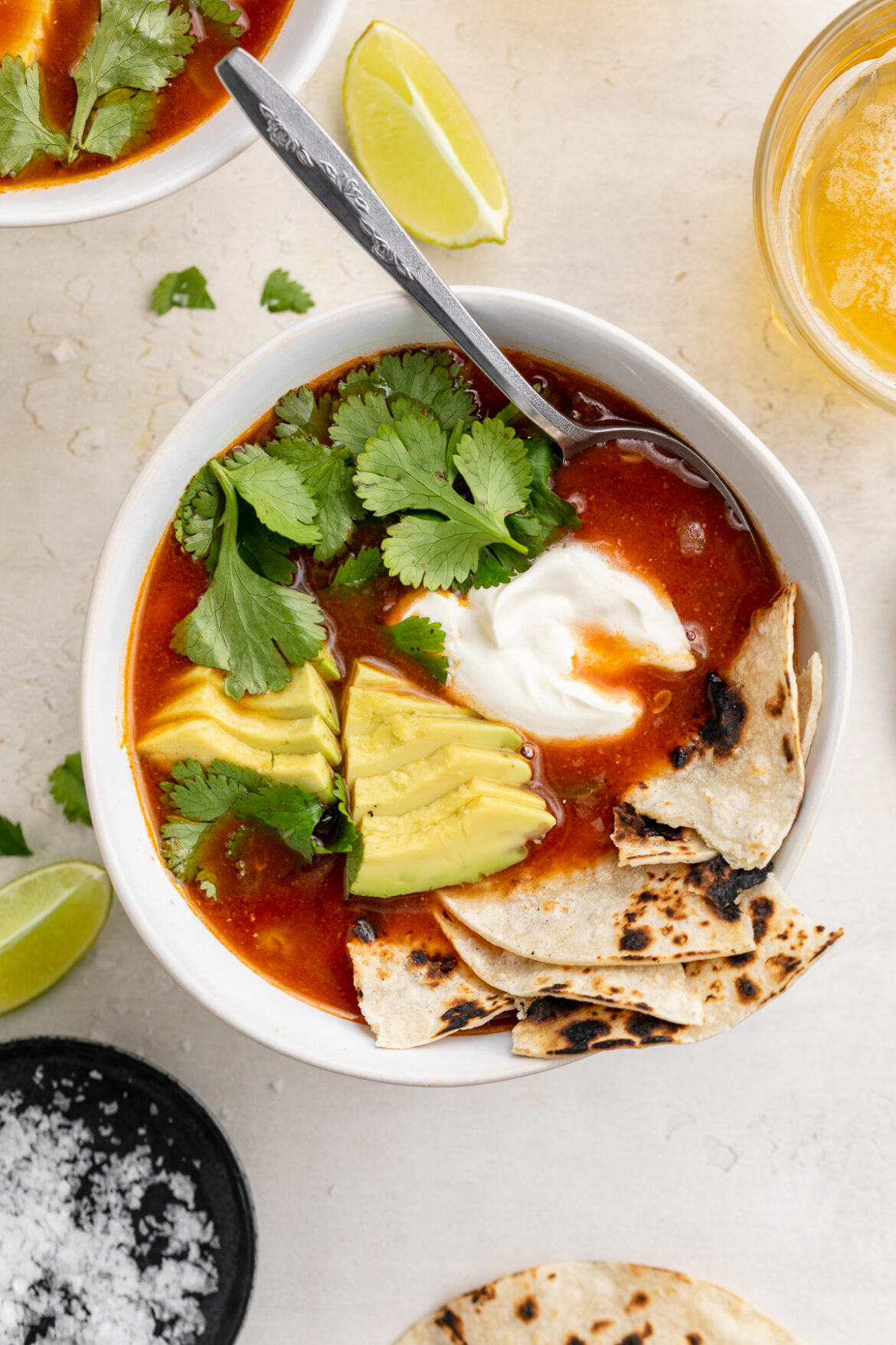 One-Pot Mexican Soup overhead image of Mexican soup with avocado, cilantro, sour cream, and tortillas on top.