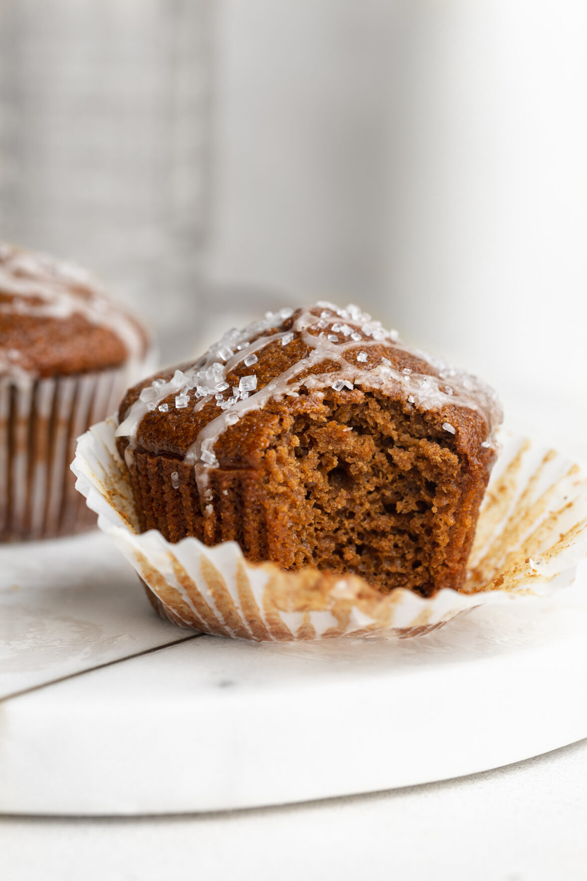 Healthy Gingerbread Muffins (made in the blender!) gingerbread muffin with a bite taken out.