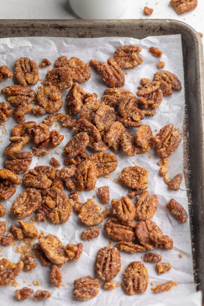 maple candied pecans on a baking sheet