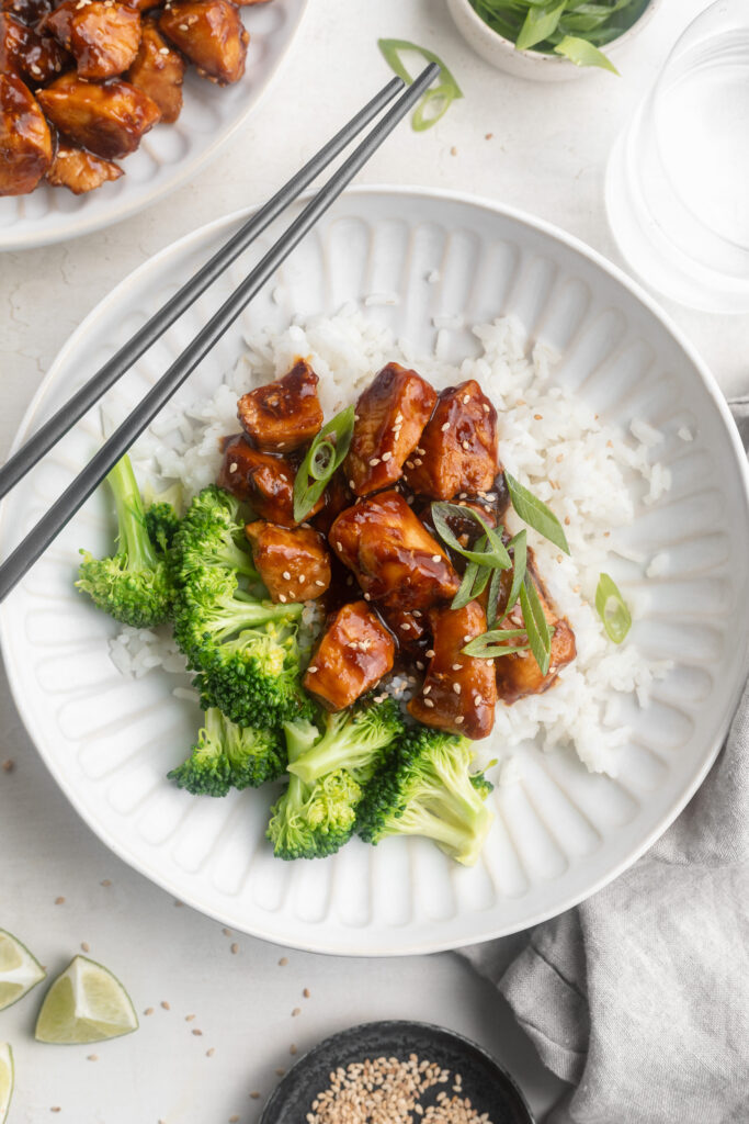 overhead image of healthy teriyaki chicken rice bowls with rice and broccoli.