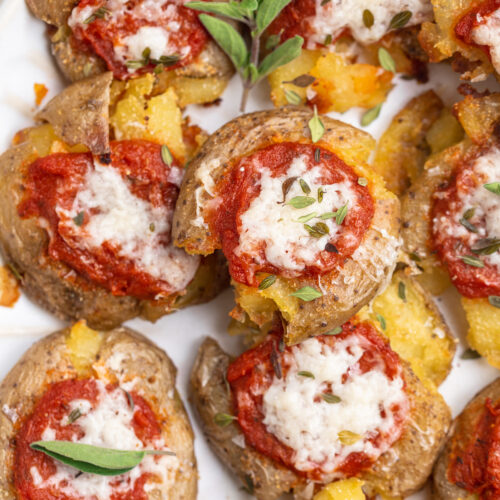 close-up overhead image of pizza smashed potatoes with oregano.