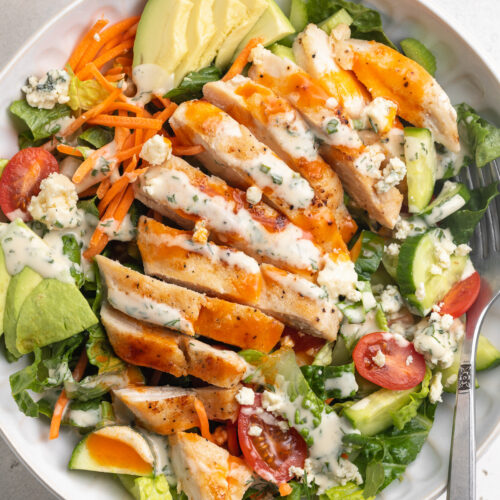 Close-up overhead image of buffalo chicken salad in a bowl.