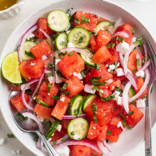 overhead image of watermelon salad in a bowl.