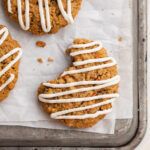 Close-up overhead image of carrot cake cookies on a baking sheet.
