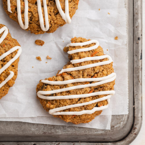 Close-up overhead image of carrot cake cookies on a baking sheet.