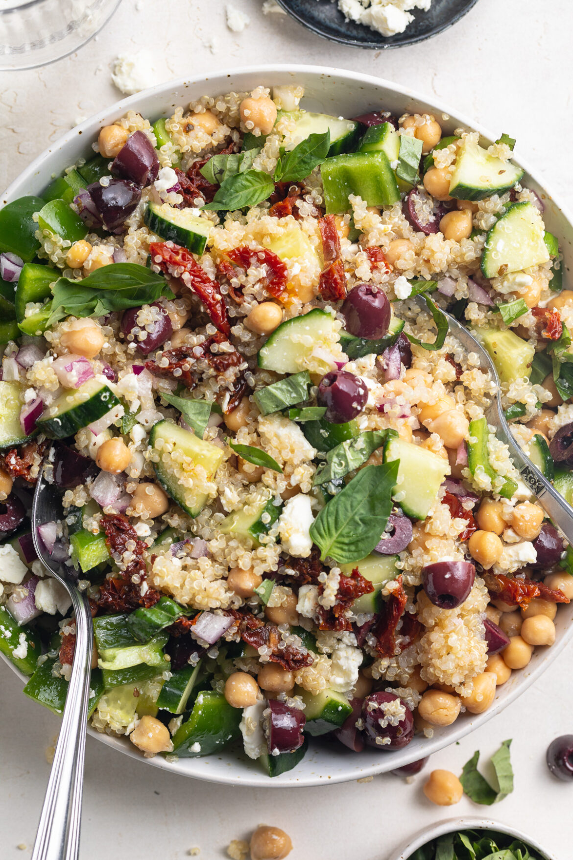 Mediterranean Quinoa Salad close-up overhead image of mediterranean quinoa salad in a bowl.