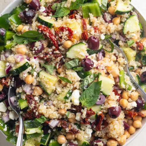 close-up overhead image of mediterranean quinoa salad in a bowl.