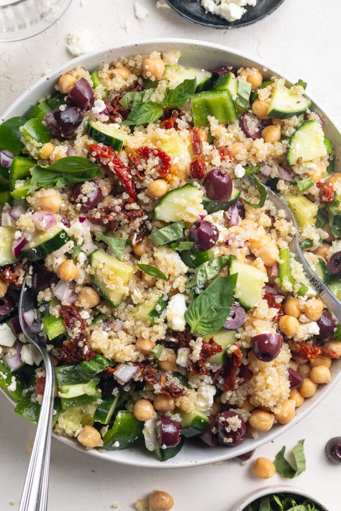 close-up overhead image of mediterranean quinoa salad in a bowl.
