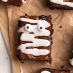 overhead close up image of mummy brownies with candy eyes.