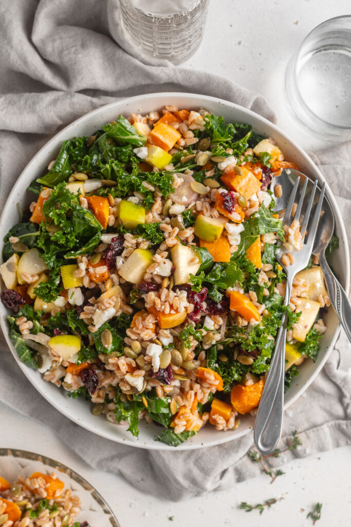 overhead image of thanksgiving salad in a bowl with water on the side.