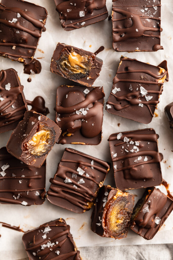 overhead image of healthy snickers bars with flaky sea salt on top.