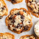 overhead image of 4 ingredient almond joy cookies on a baking sheet.