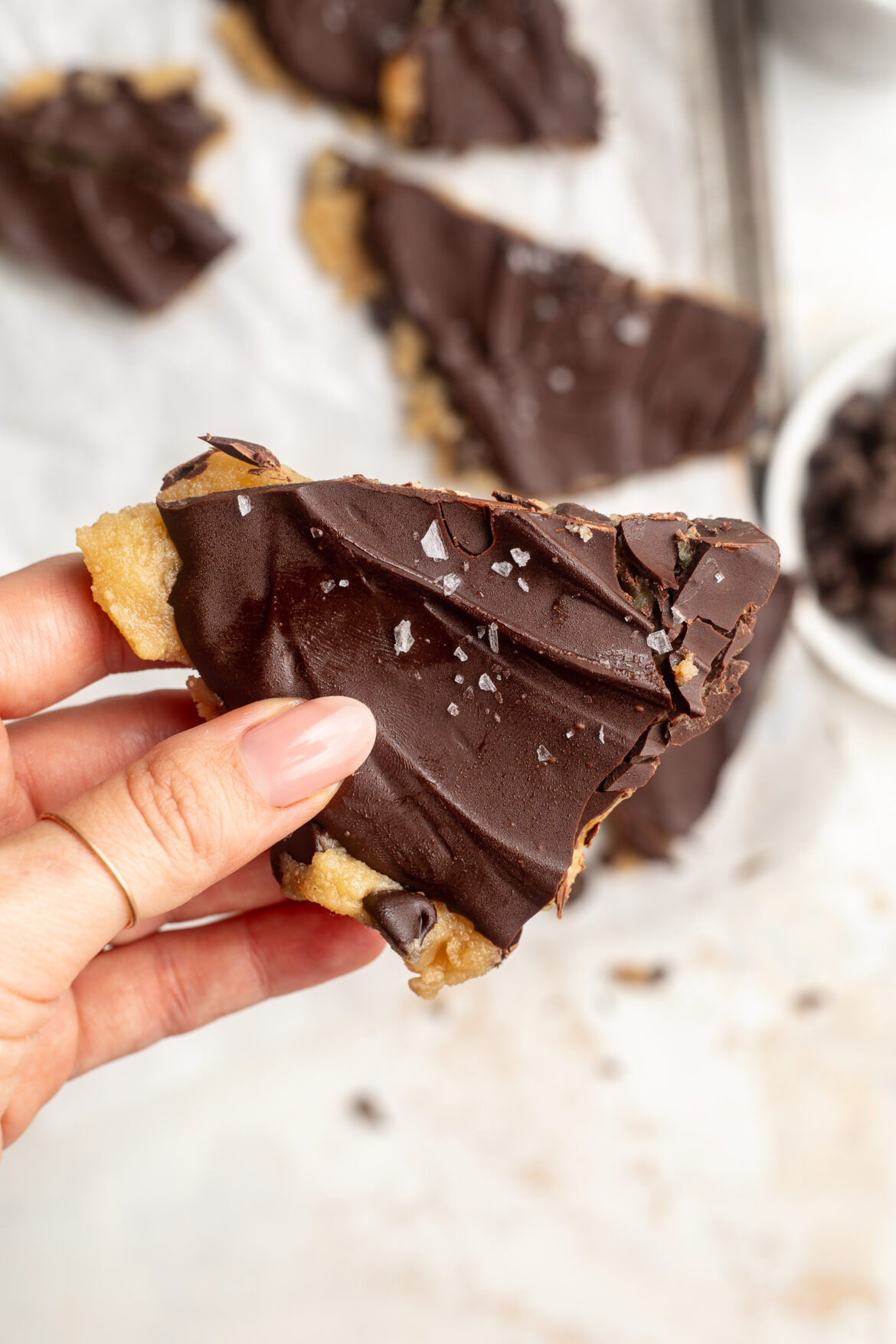 4 Ingredient Cookie Dough Bark (vegan and gluten-free!) 4 ingredient gluten free cookie dough bark piece with sea salt on top.
