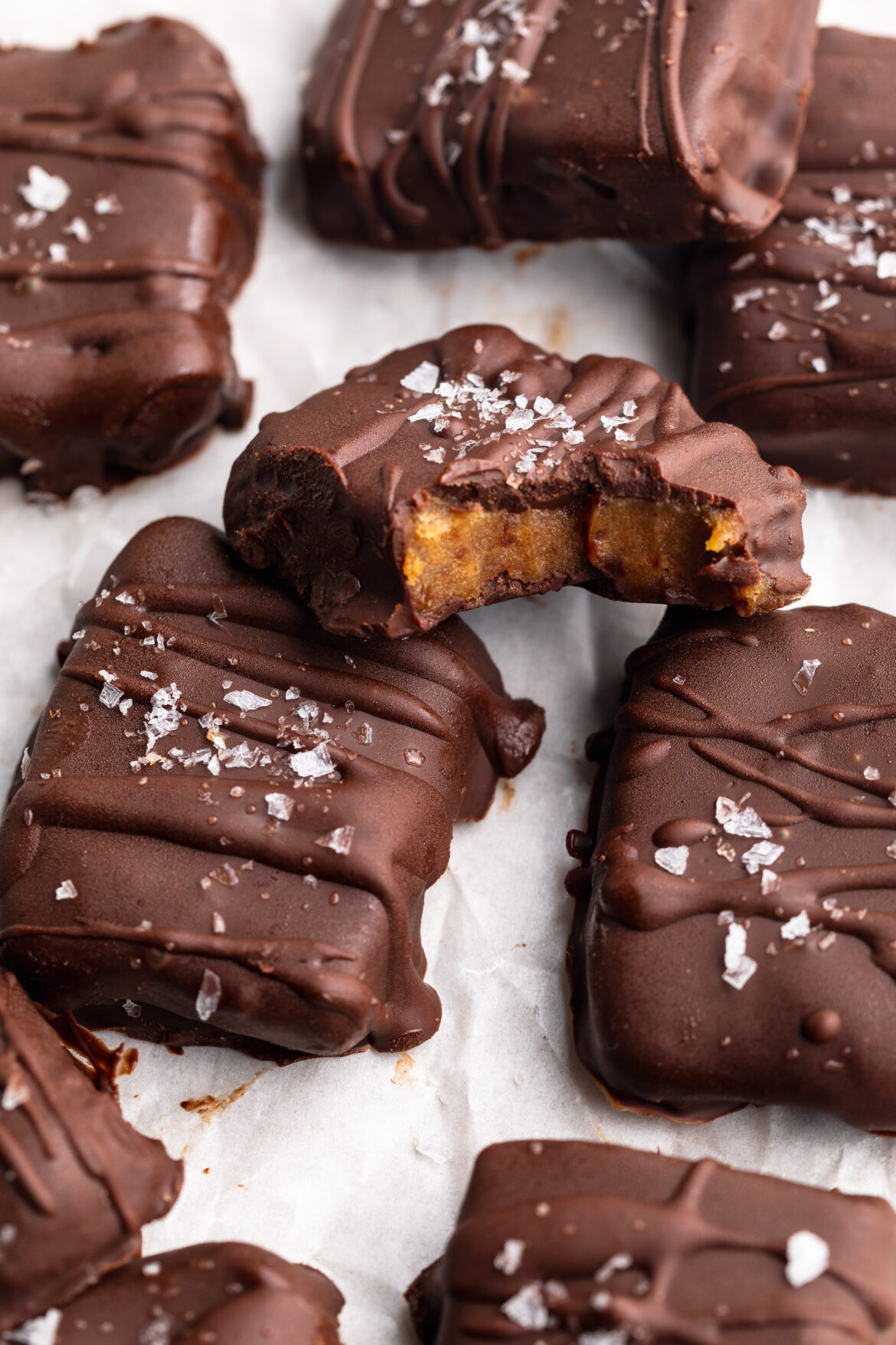 4 Ingredient Date Caramels date caramels on a plate with flaky sea salt on top.
