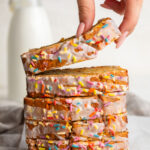 5 ingredient gluten-free birthday cake banana bread slices stacked on top of each other.