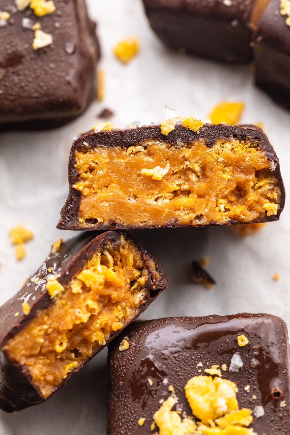 Healthy Homemade Butterfingers close up image of healthy butterfingers cut in half.