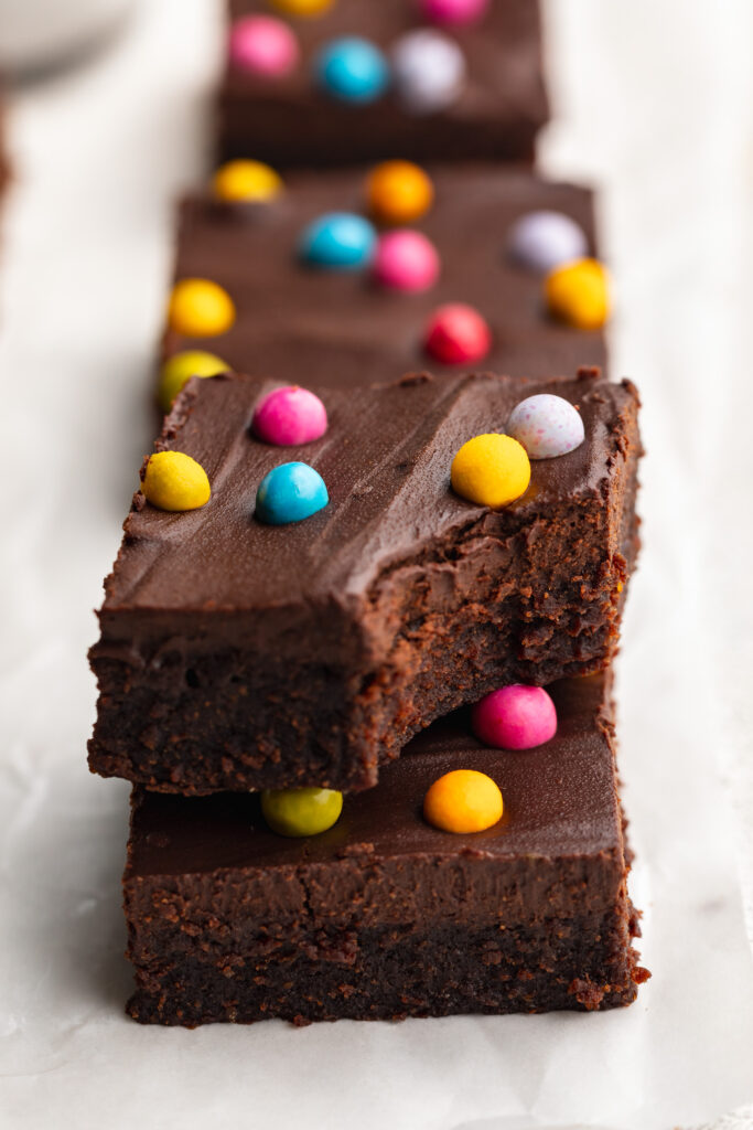 healthy gluten free cosmic brownie with a bite taken out