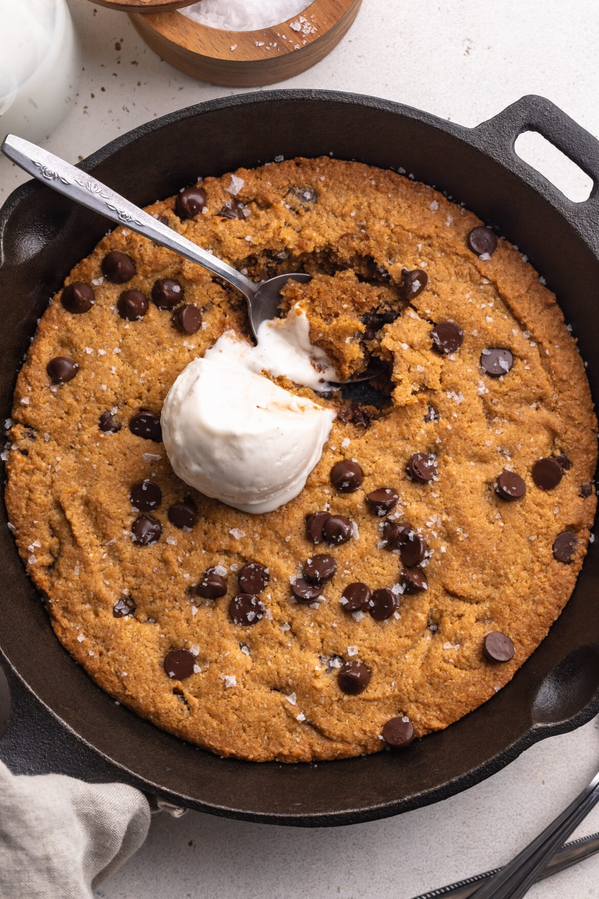 Healthy Gluten-Free Cookie Skillet overhead image of healthy gluten-free cookie skillet with a scoop of vanilla ice cream on top.