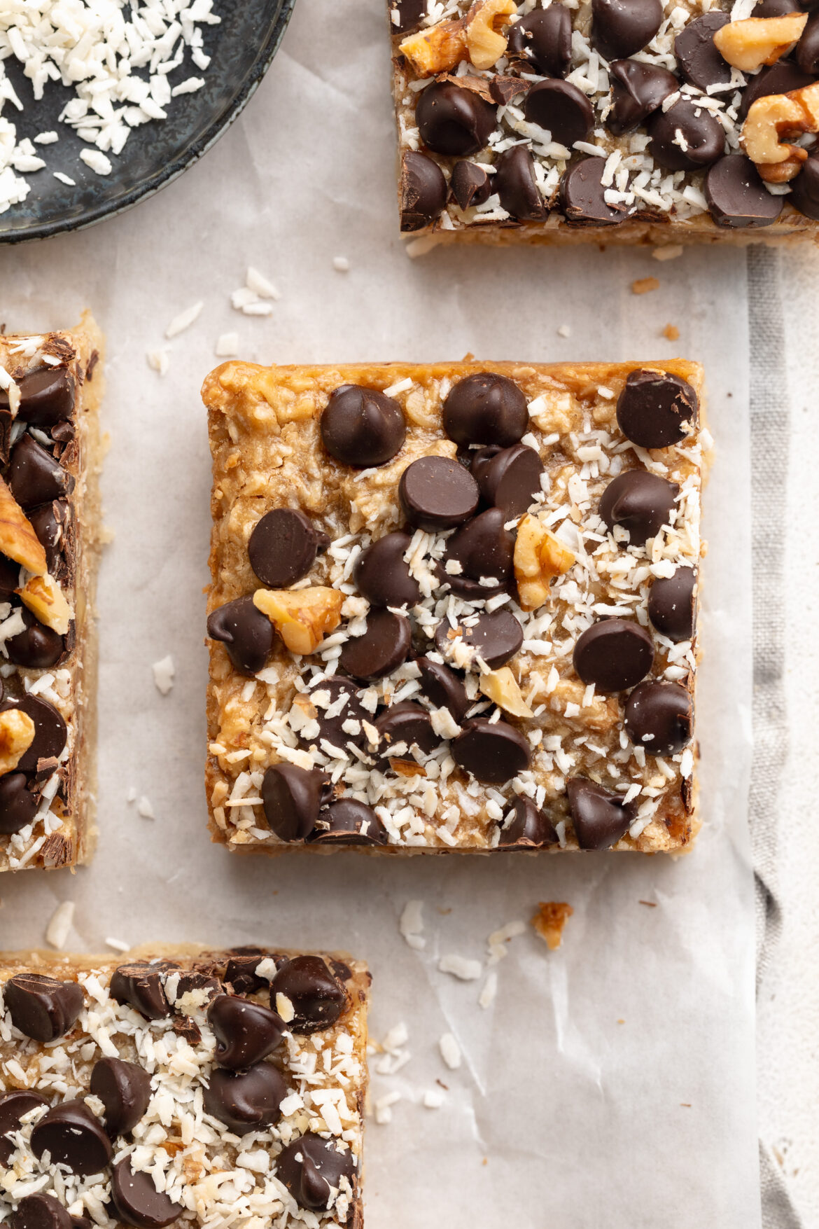 Healthy Gluten-Free Magic Bars overhead image of a healthy gluten-free magic bar with chocolate chips on top.