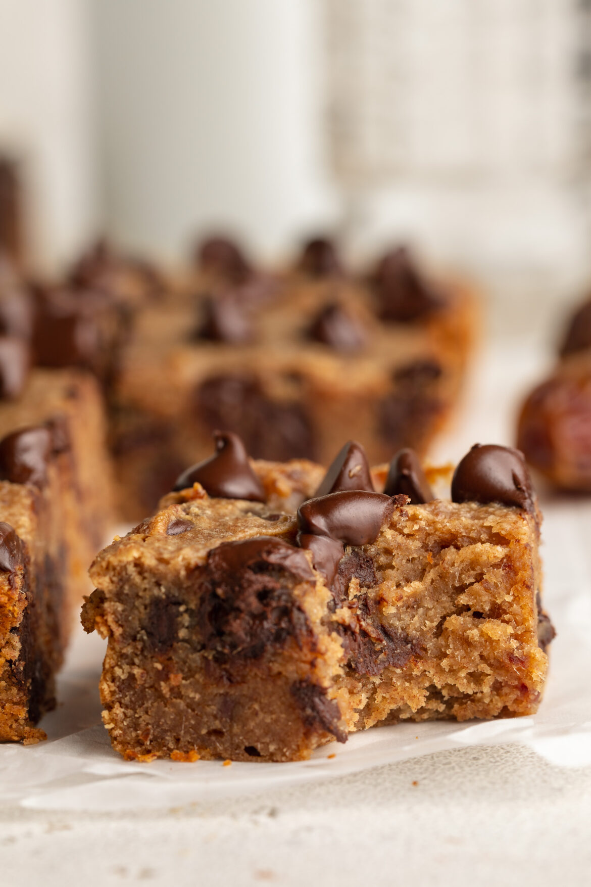5-Ingredient Chocolate Chip Date Cake a slice of chocolate chip date cake with a bite taken out.