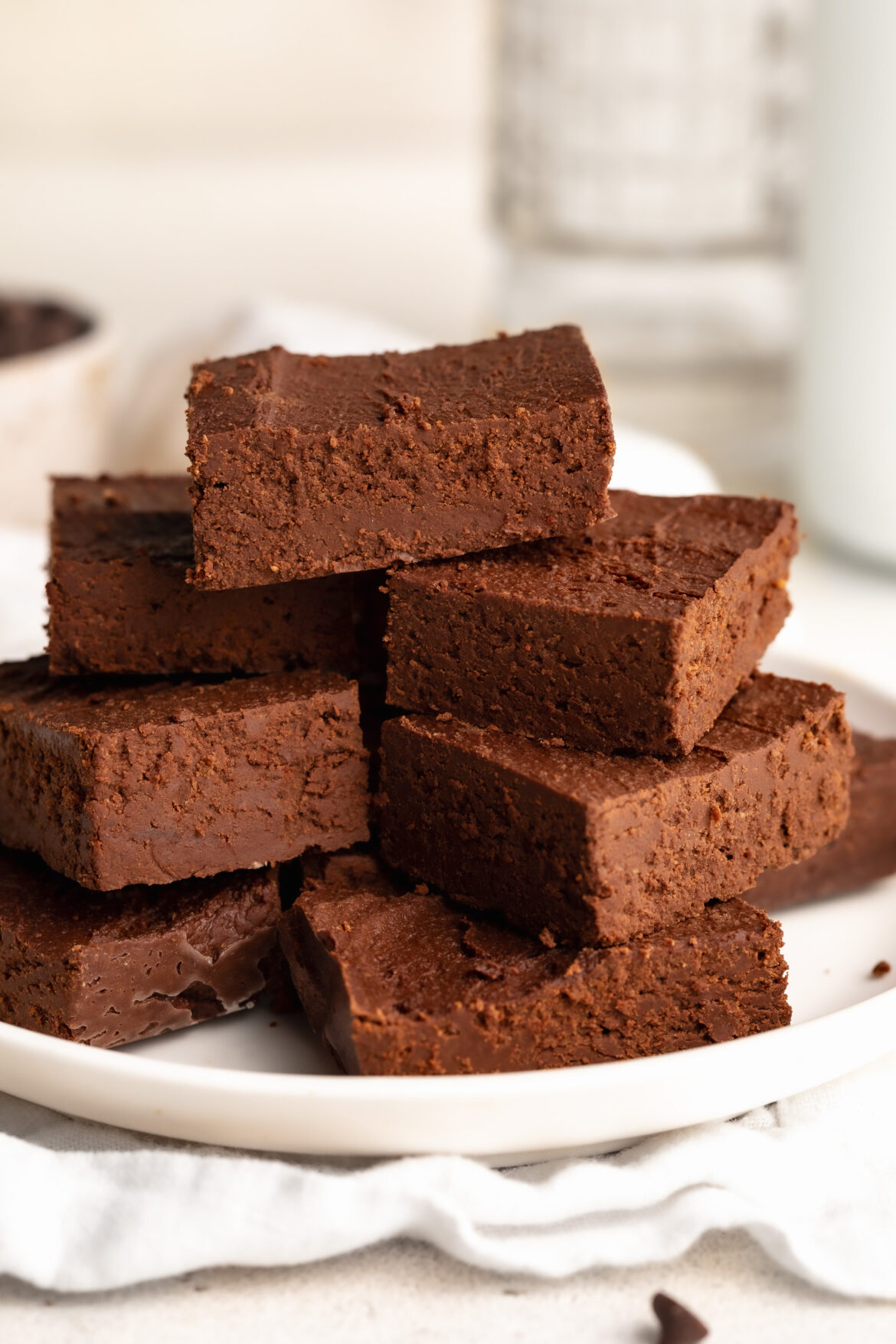 Magic 2-Ingredient Healthy Fudge 2 ingredient healthy fudge stacked on a plate.
