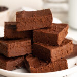 2 ingredient healthy fudge stacked on a plate.
