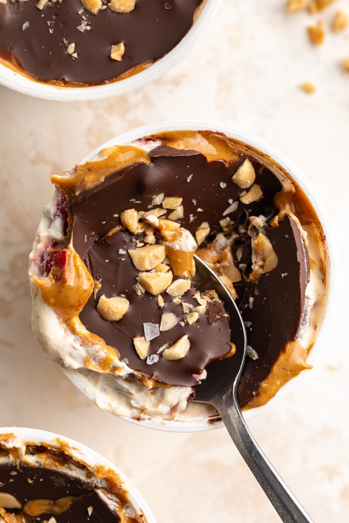 Chocolate Shell Yogurt Cups overhead image of chocolate shell yogurt cup with chopped peanuts on top.