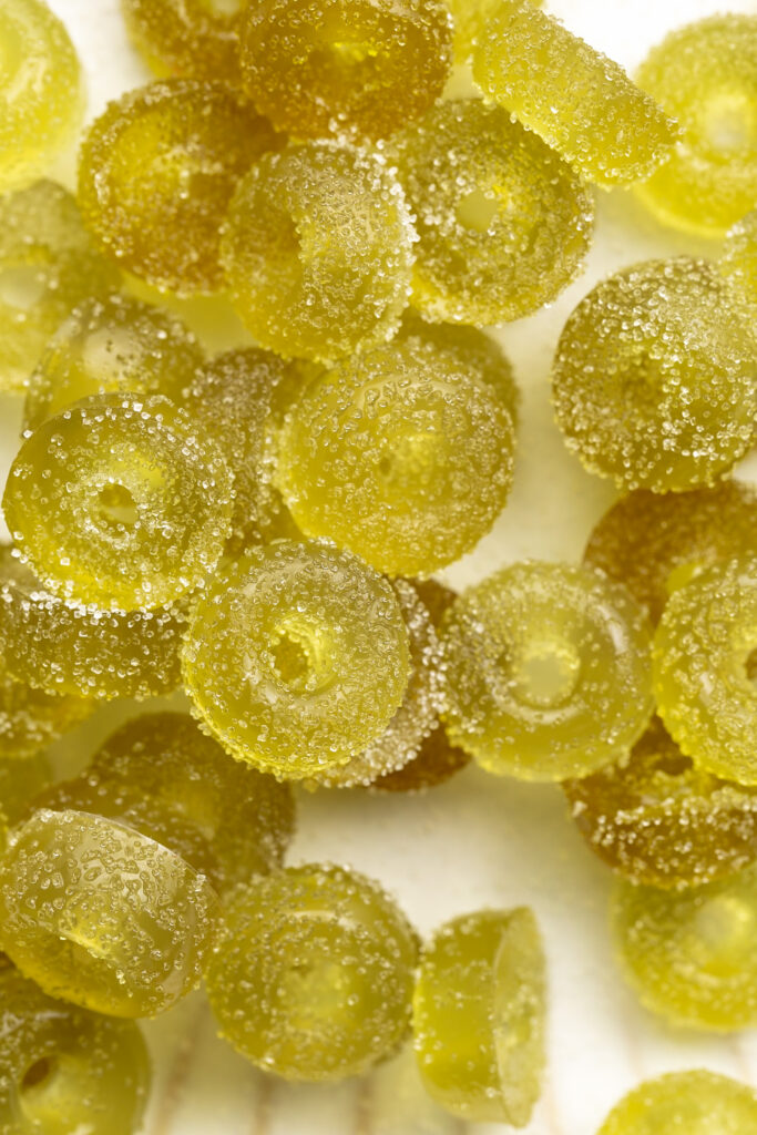 close up image of healthy sour apple collagen gummies