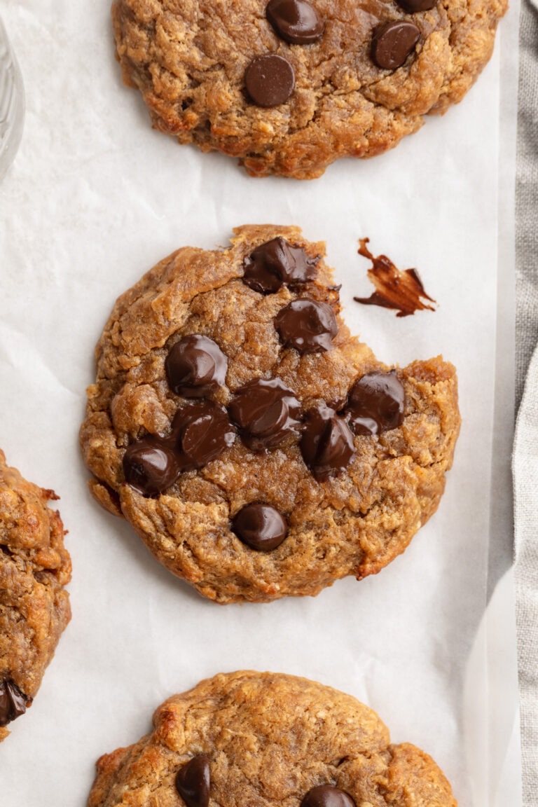 overhead image of 3 ingredient protein cookies with a bite taken out.