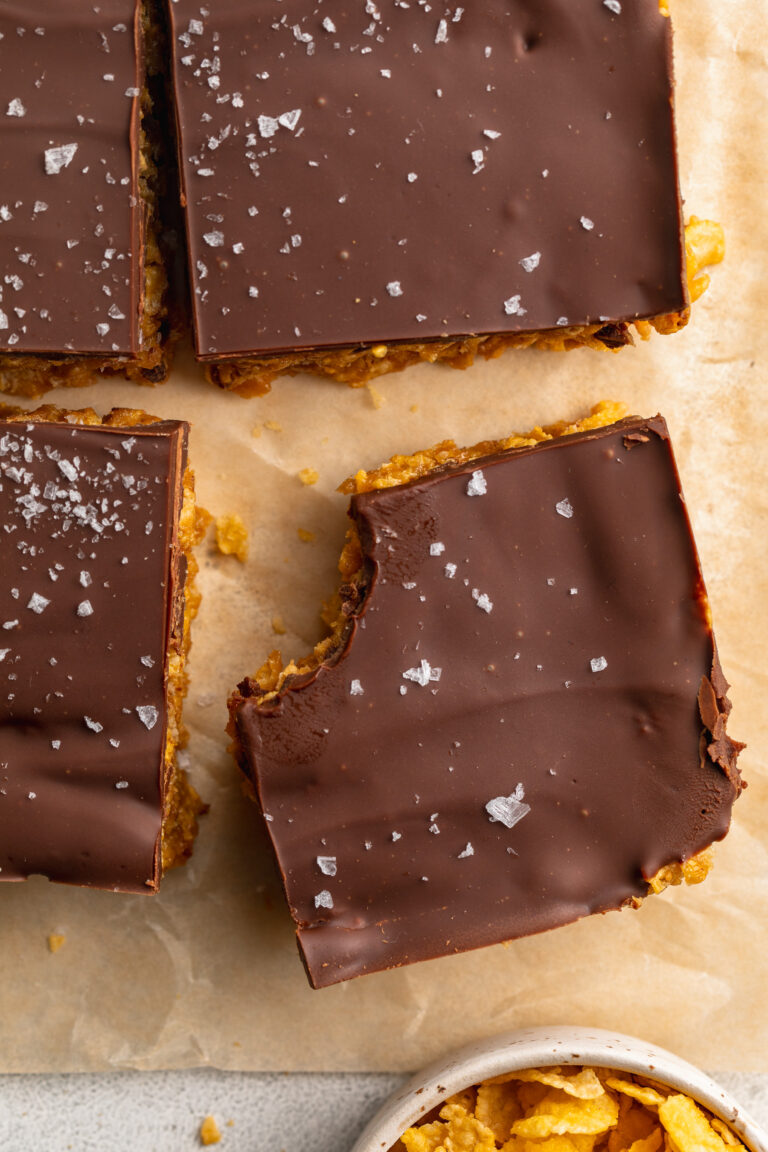 overhead image of peanut butter cornflake bars with a bite taken out.