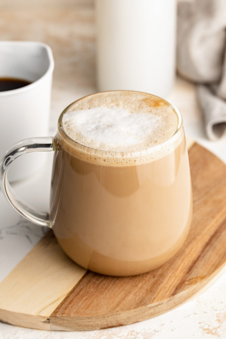 protein coffee on a table with coffee and milk on the side.