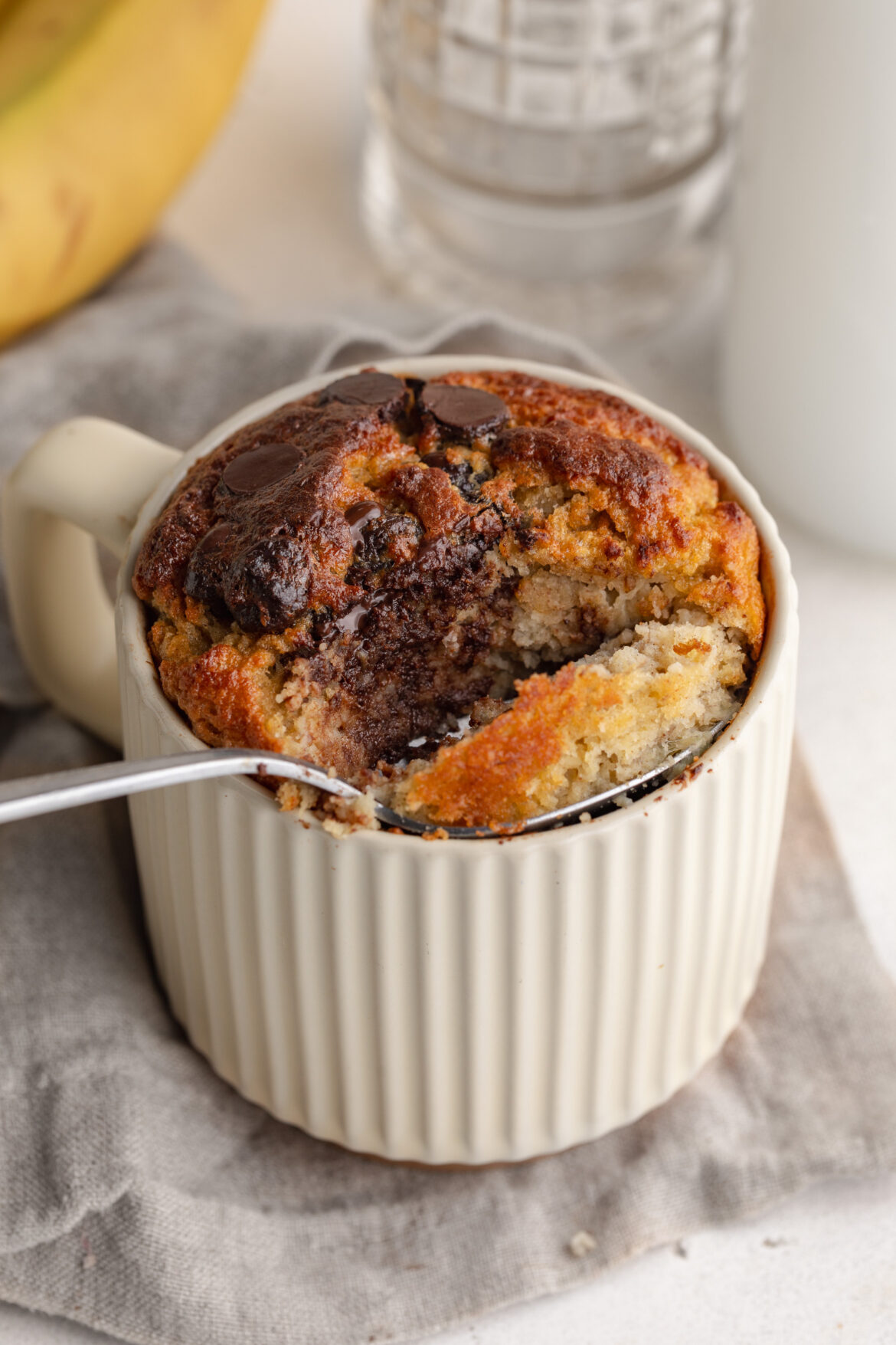 healthy banana mug cake with a spoon