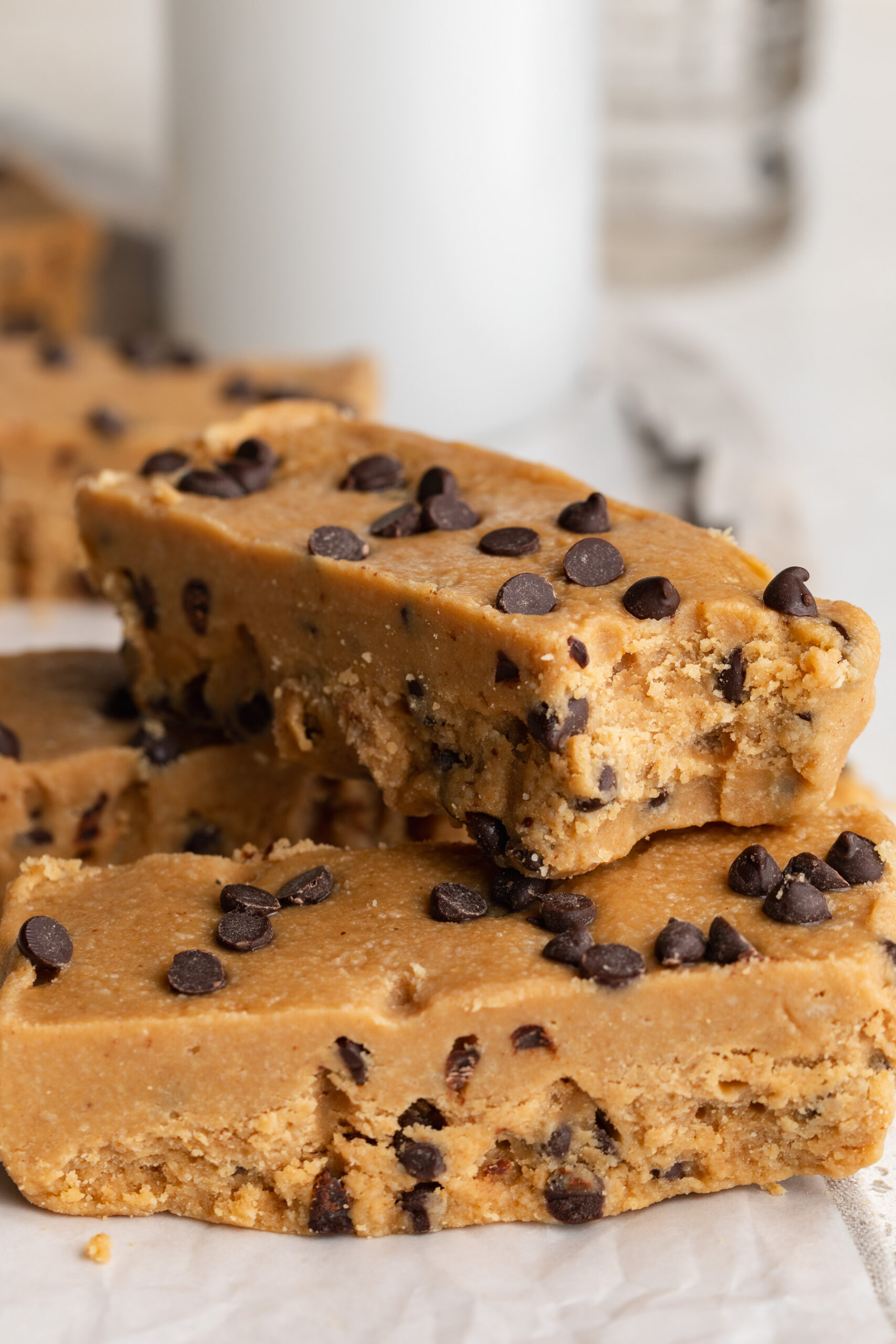 a bite taken out of a collagen cookie dough protein bar