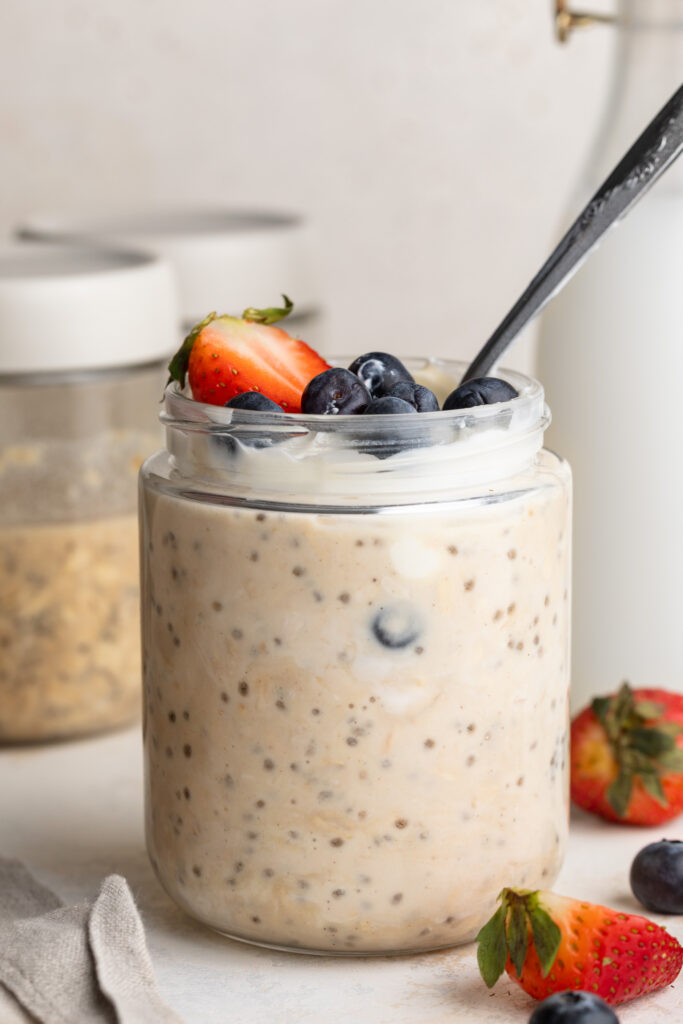 high protein overnight oats in jars on a table.