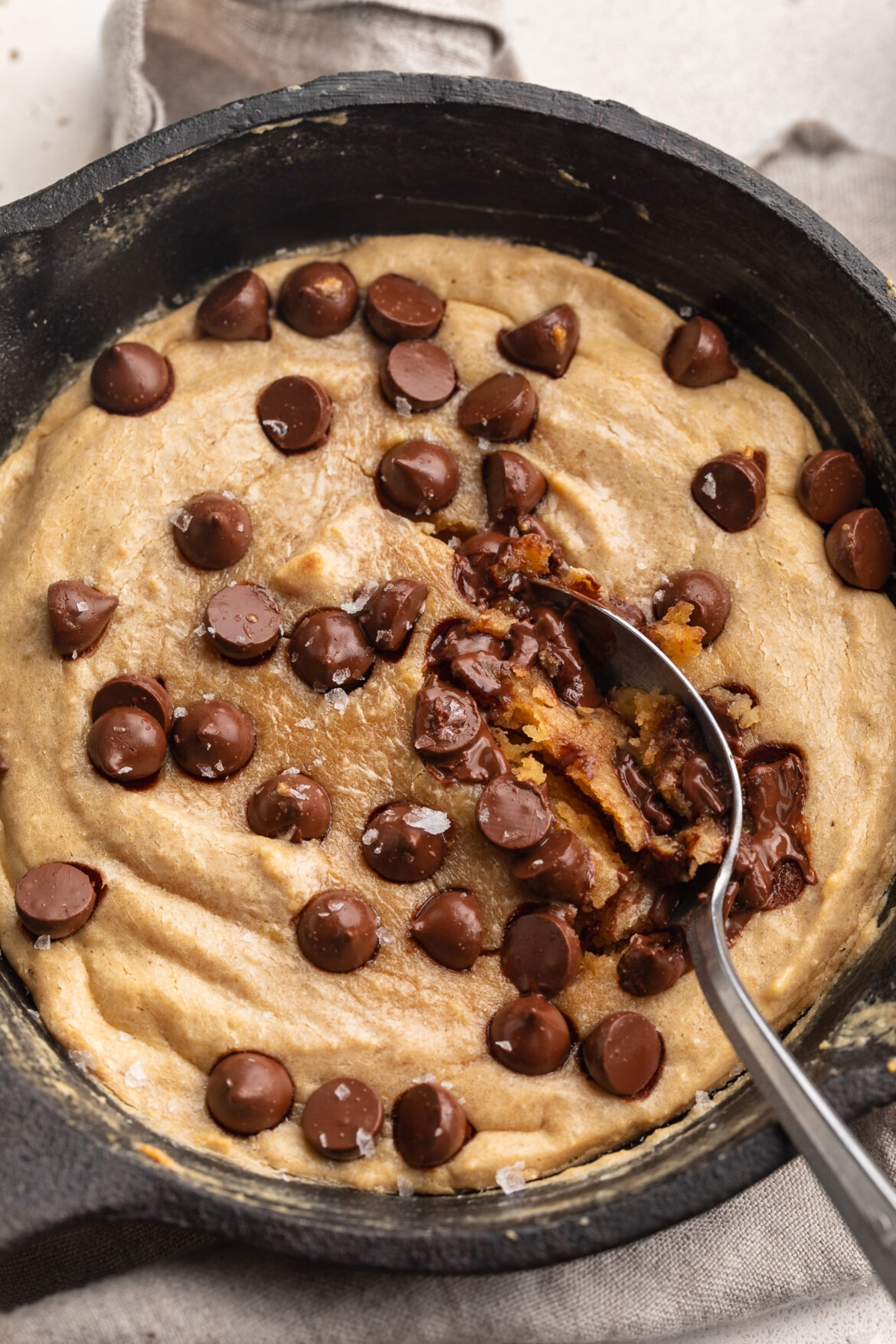close up image of protein cookie skillet with chocolate chips on top.