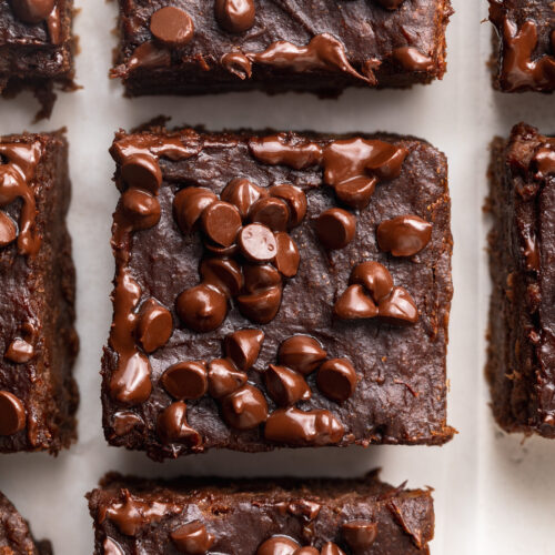 overhead image of 4 ingredient protein brownies with mini chocolate chips on top.